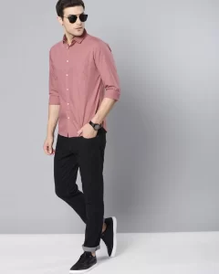 Man in dark pink shirt and black pants
