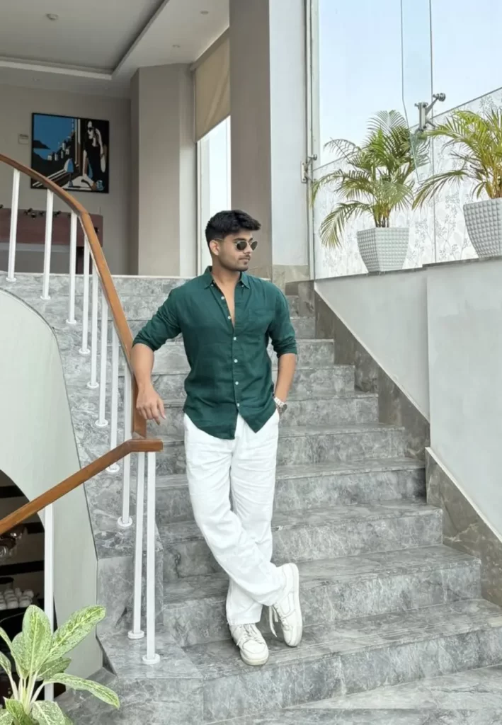 Dark green shirt with white trousers