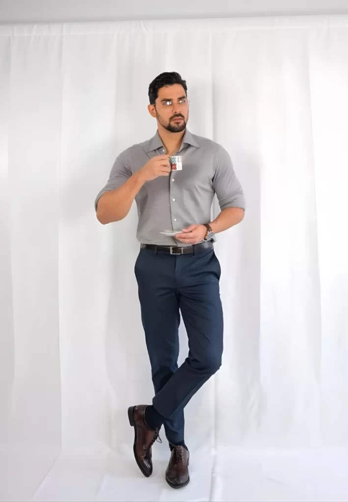 Man wearing grey shirt navy pants