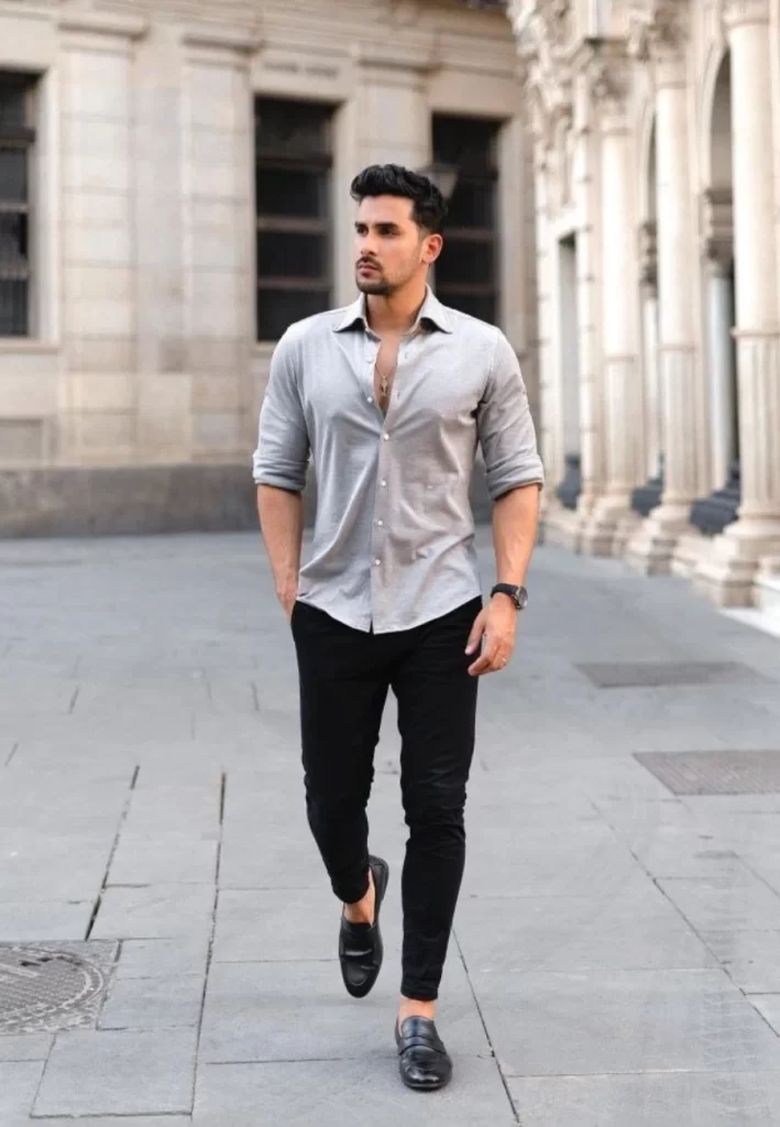Man wearing grey shirt and black pants