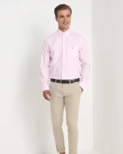 Man wearing pink shirt with beige pants