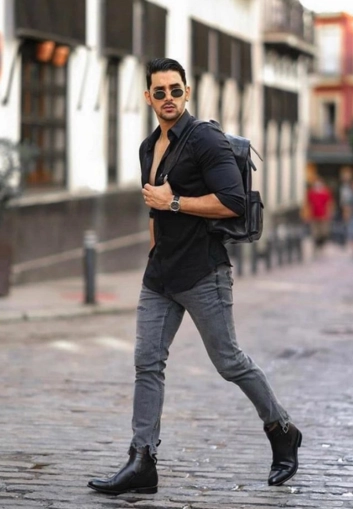 Stylish man with black shirt and boots