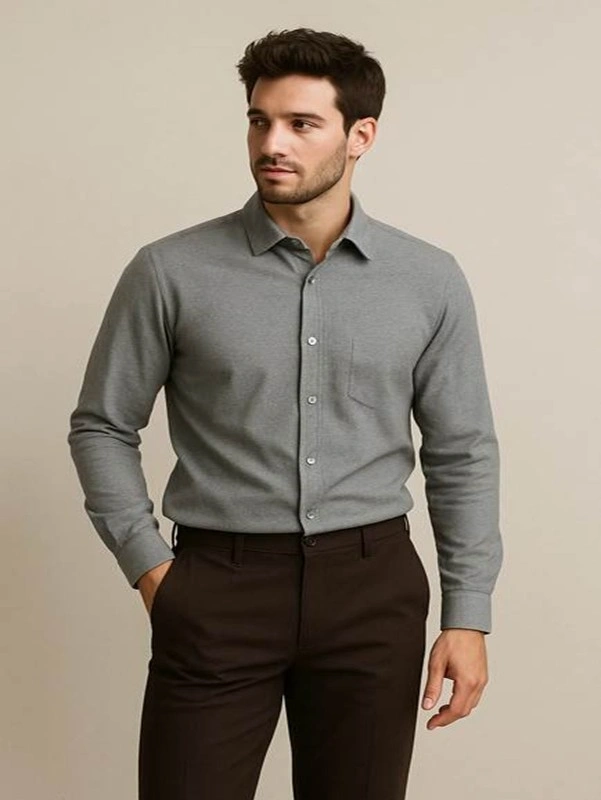 Man wearing grey shirt brown pants
