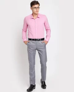 Man in pink shirt and grey pants
