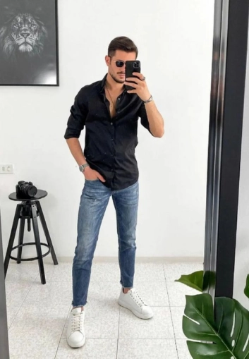 Man in black shirt, white sneakers